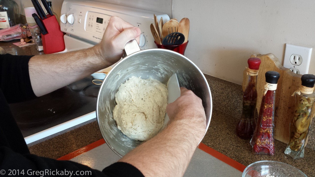 Using the bowl scraper, work the dough out of the bowl.