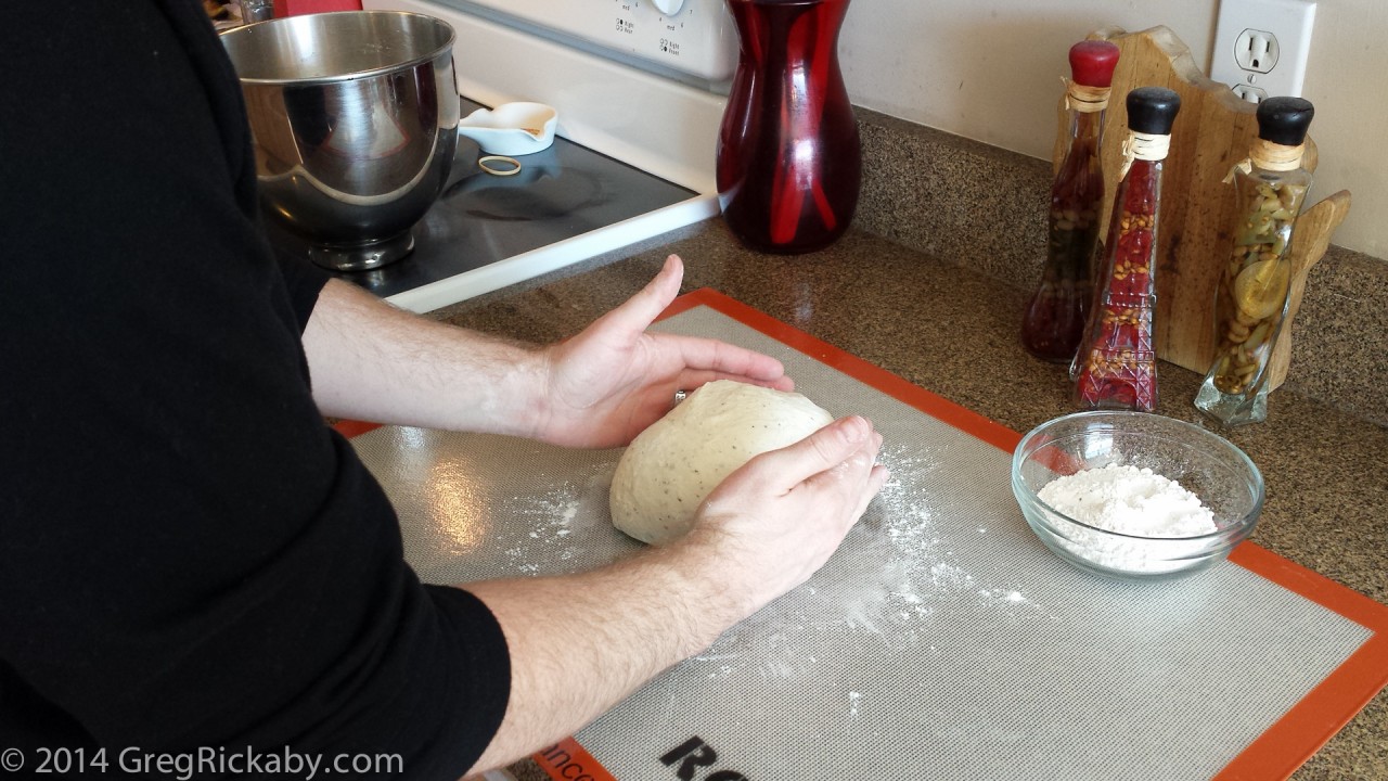 Now, start "cupping" the dough to begin forming a ball.