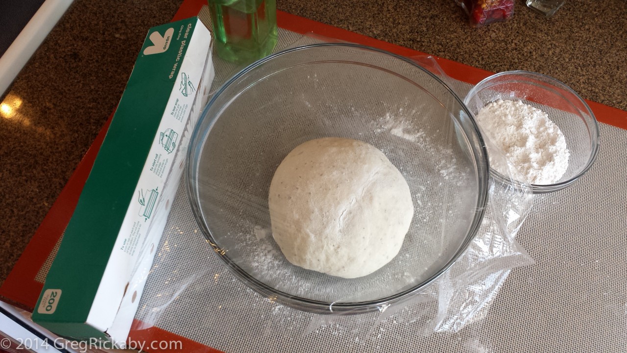 Place the dough inside the bowl, and cover with plastic wrap.