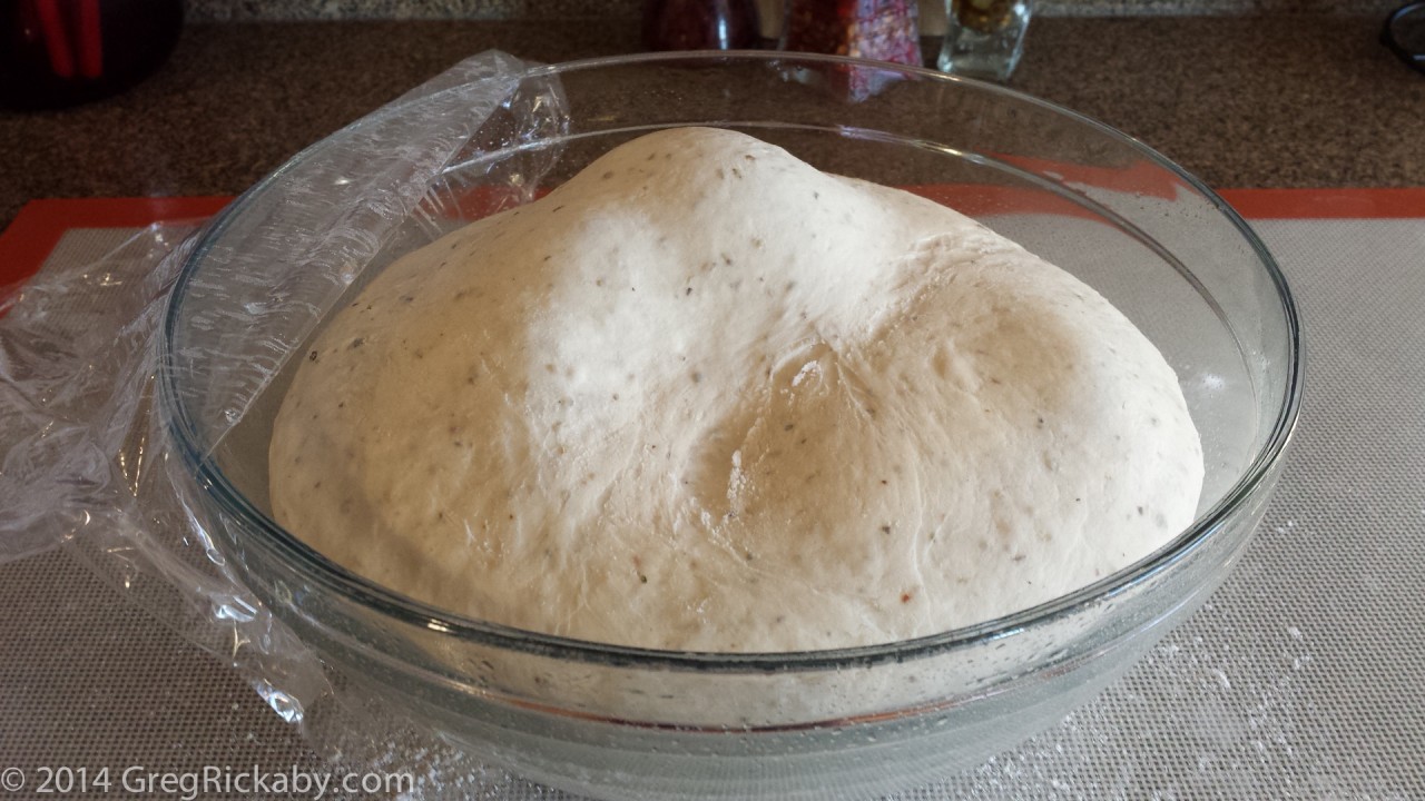 Take the pizza dough out of the refrigerator at least 3 hours before you plan to bake. Just leave it in it's bowl, covered, and let it warm up on your countertop.