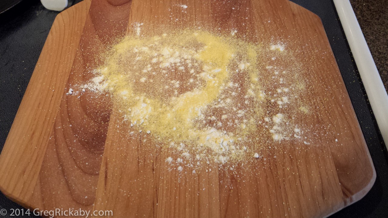 Sprinkle some more cornmeal and flour on the pizza peel.