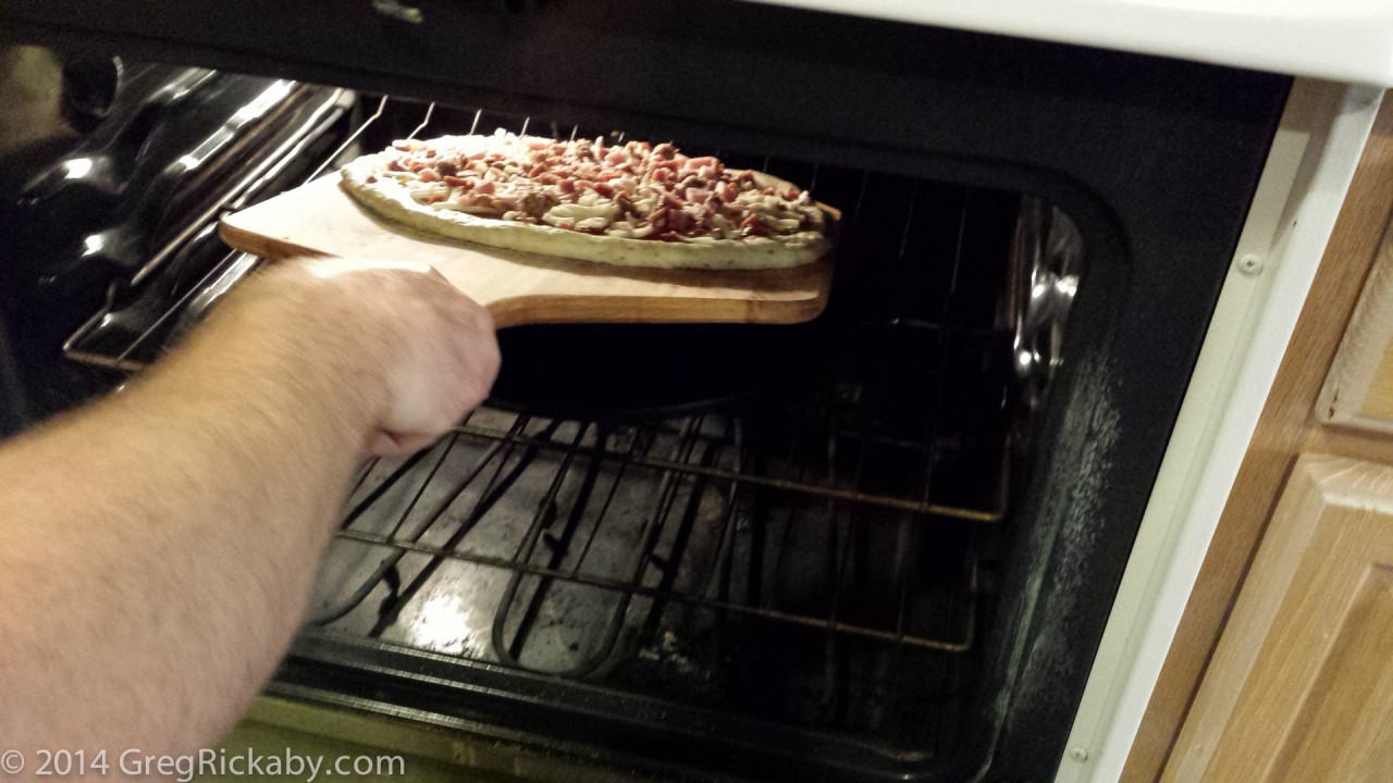 Slide the pizza off the peel and onto the pizza stone.