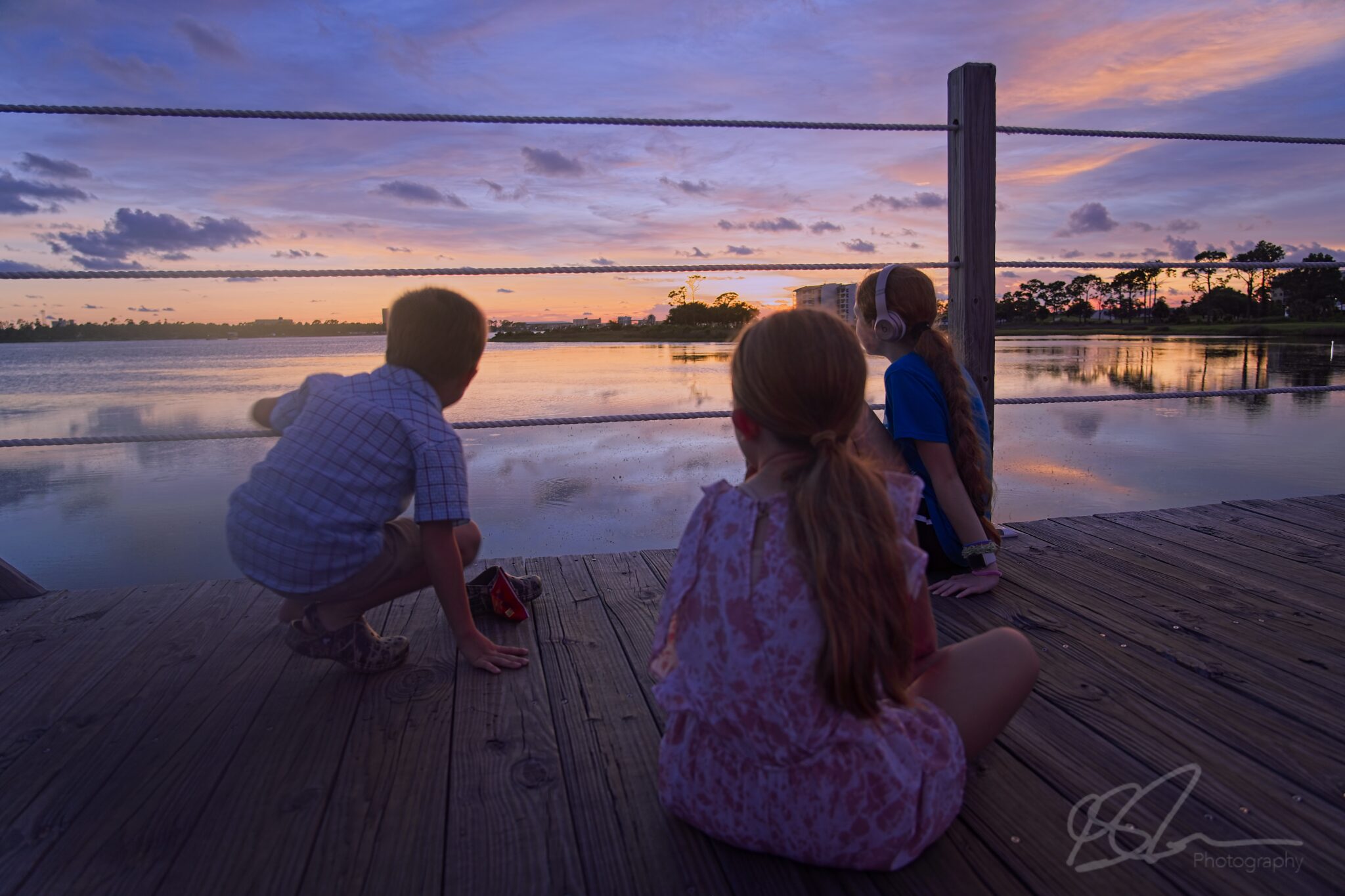 The kids enjoying the sunset and watching the Great Egret